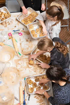 Party group placing chocolate babka on trays