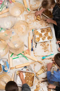 Party group placing chocolate babka on trays