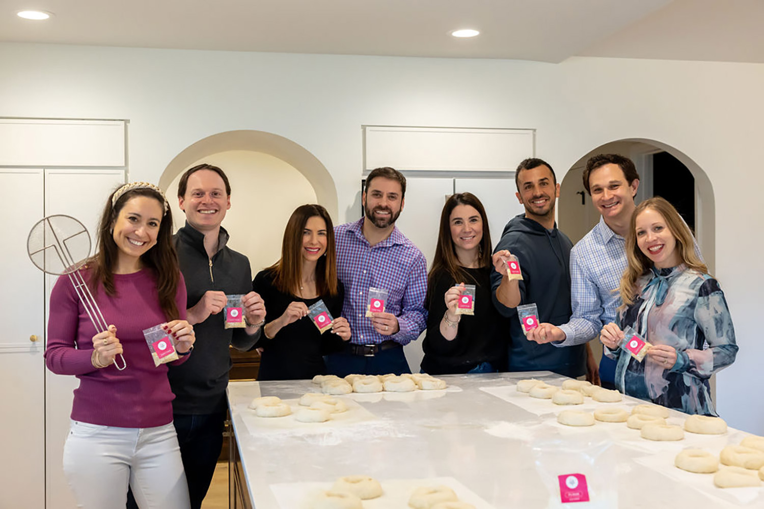 Group of colleagues working on their team building skills while baking at Just Bake It. For more information visit our workshop schedule.